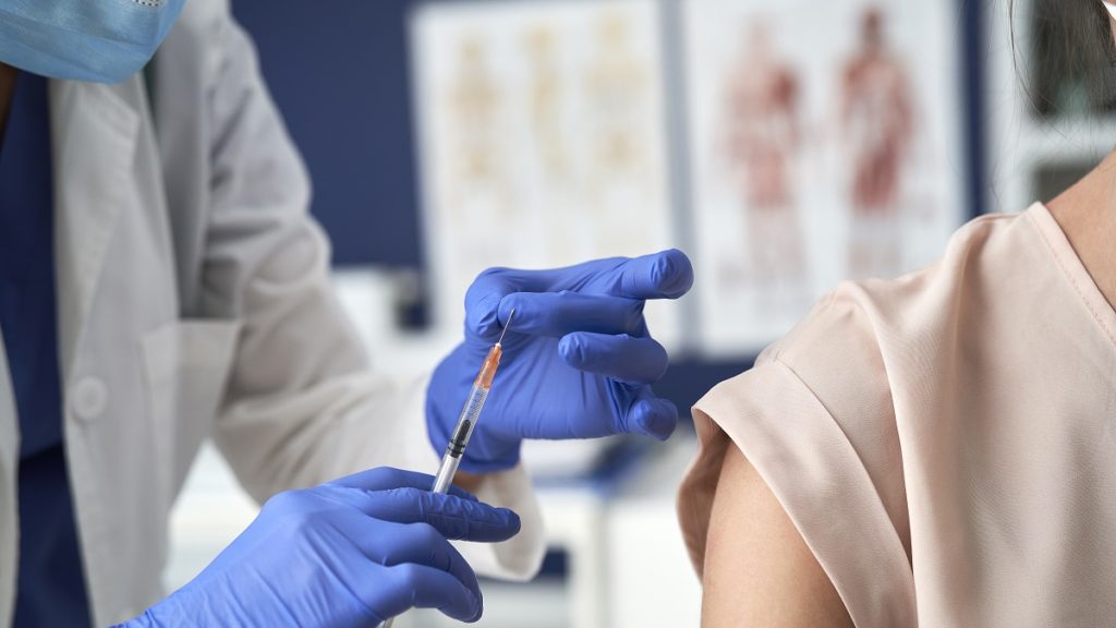 close up of vaccination in a doctors office 4RHBHYM