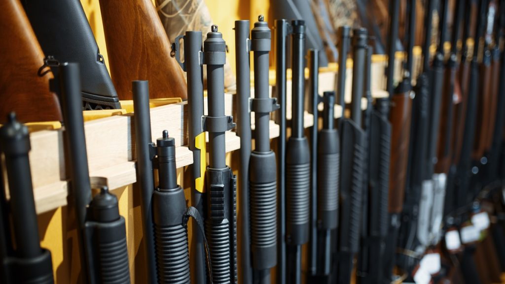 row of rifles in gun shop closeup nobody CGGBX38