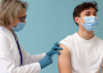 medium shot man getting vaccine copy