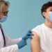medium shot man getting vaccine copy