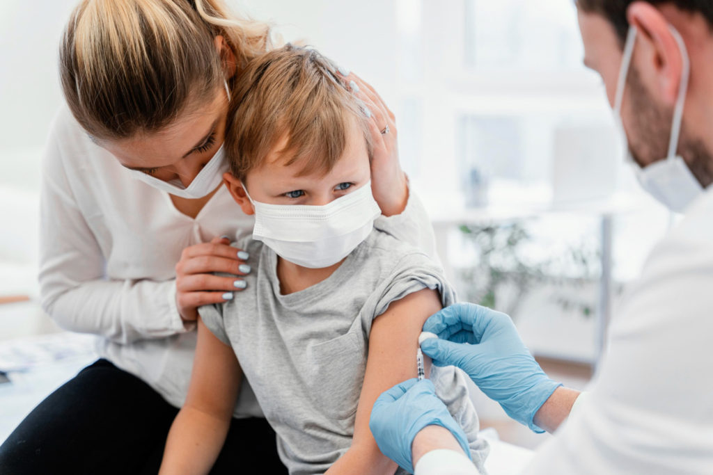 close up kid getting vaccine copy