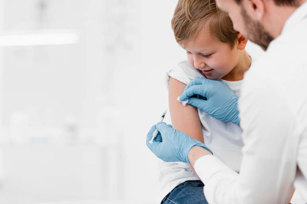 close up doctor vaccinating kid