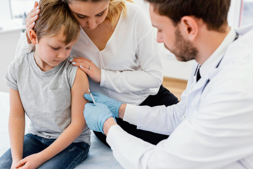 close up kid getting vaccinated copy