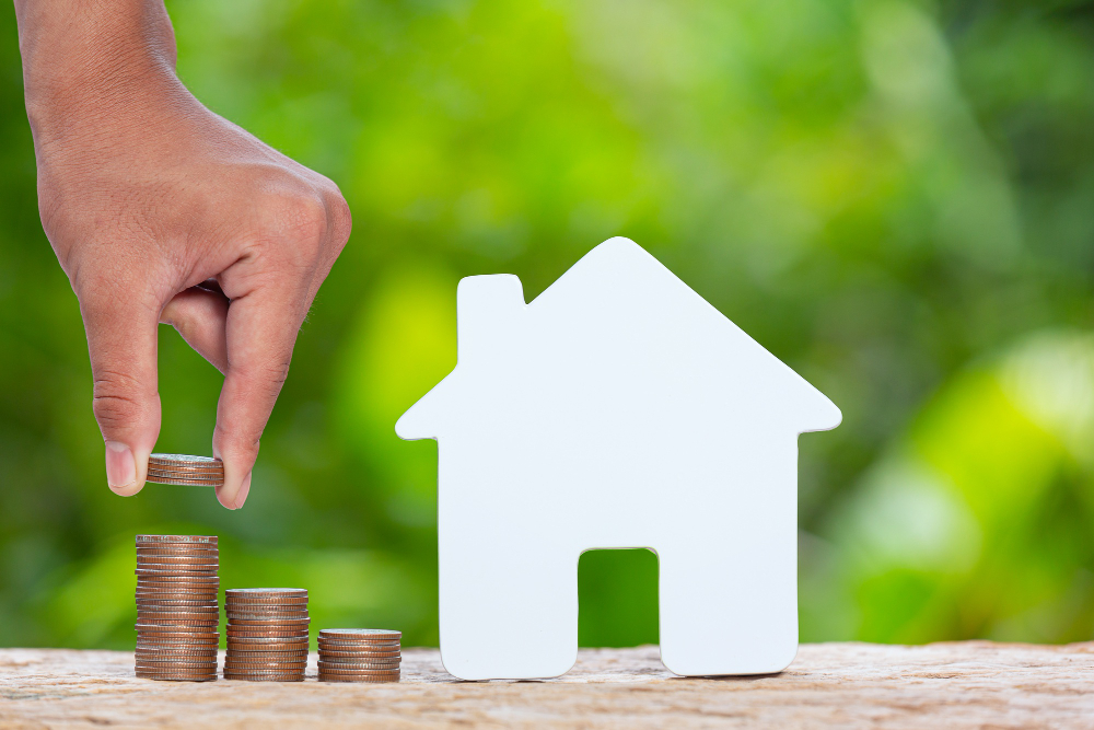 world habitat day close up picture pile coins model house