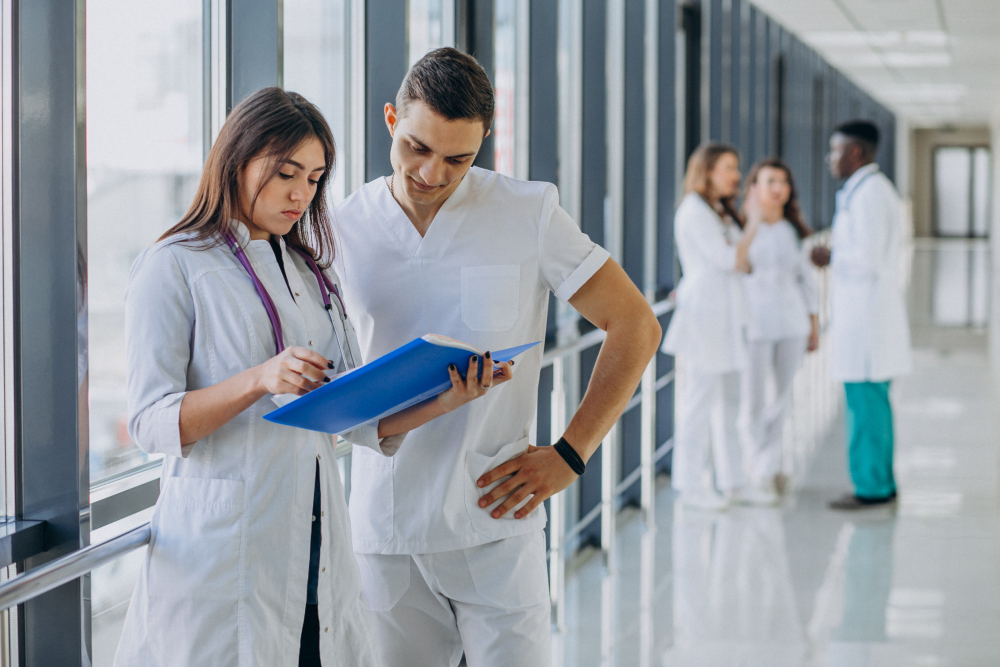 team young specialist doctors standing corridor hospital