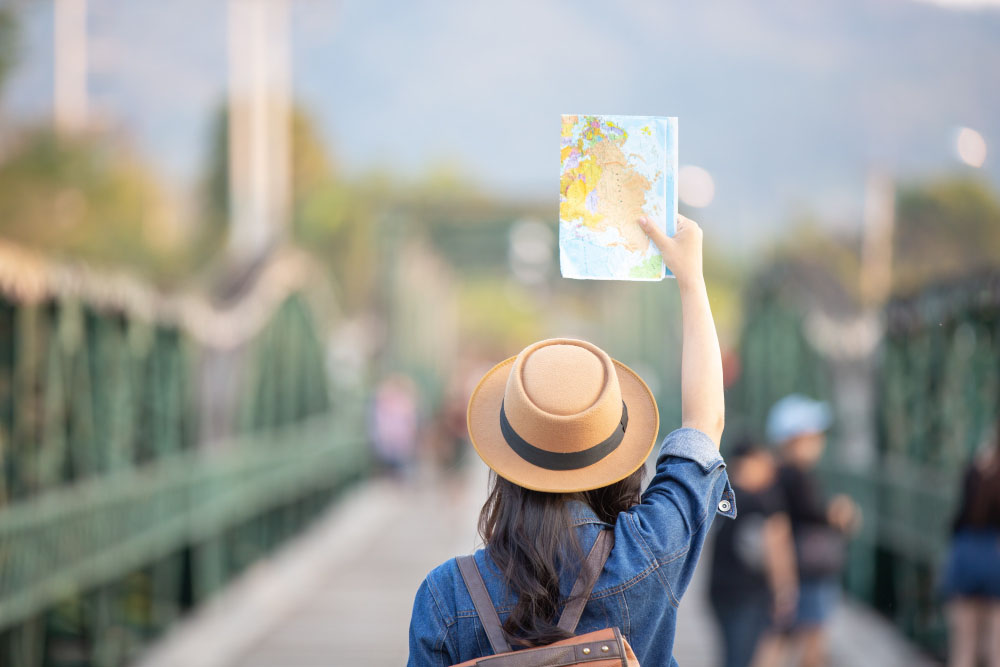 female tourists hand have happy travel map copy