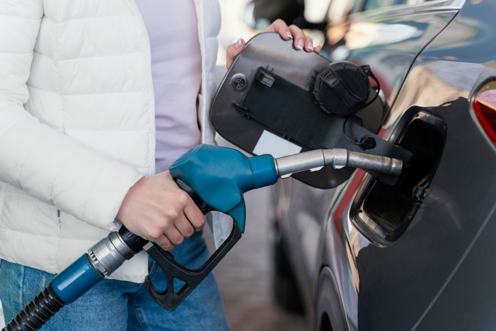 woman filling up car gas station