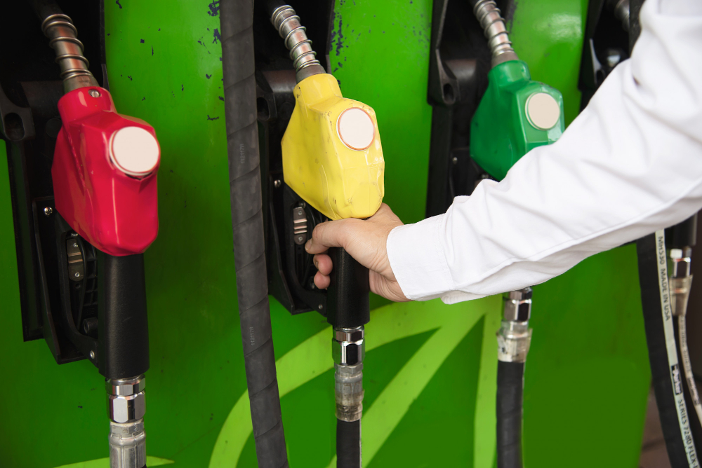 man putting gasoline fuel into his car pump gas station