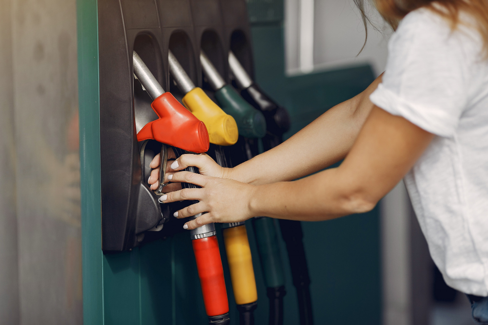 elegant woman standing gas station