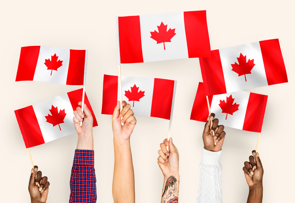 hands waving flags canada