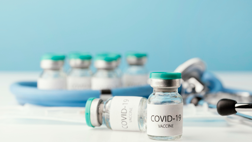 assortment with coronavirus vaccine bottle