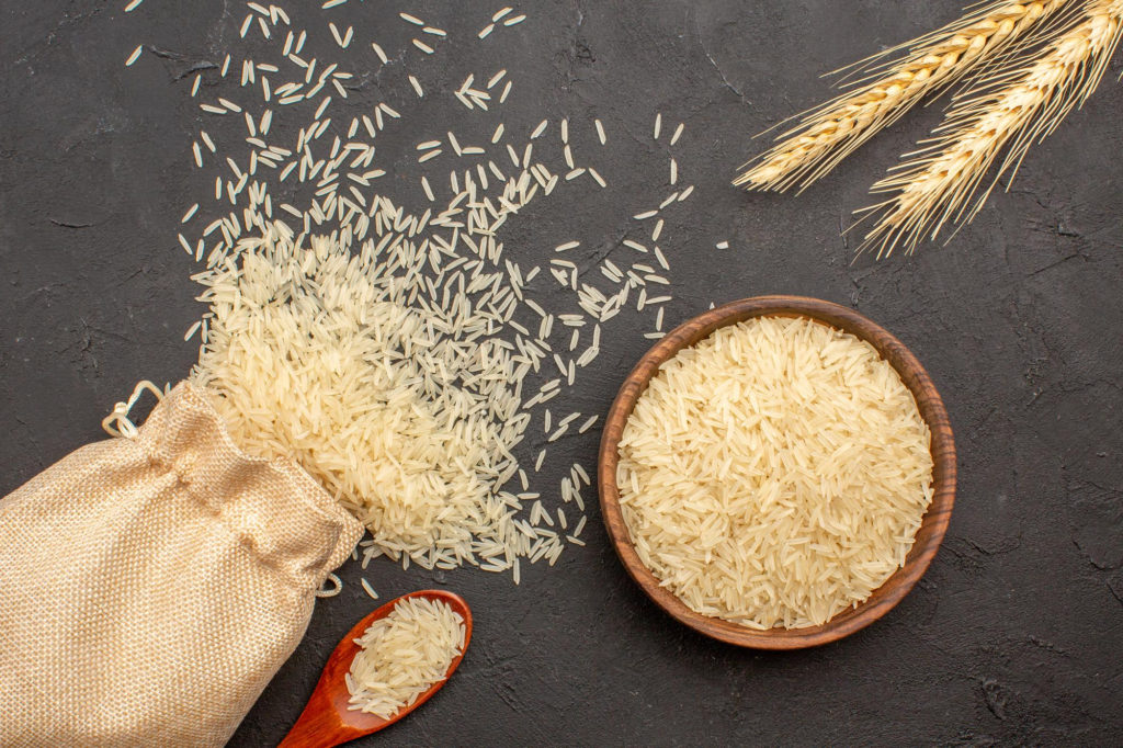 top view raw rice inside bag plate grey surface