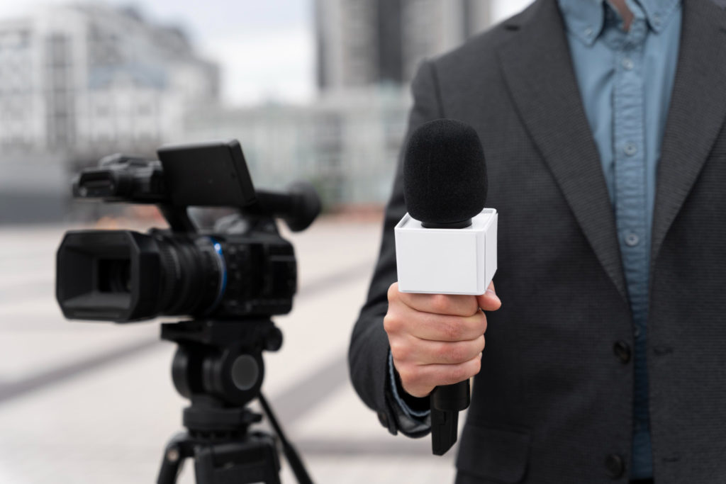 front view journalist holding microphone