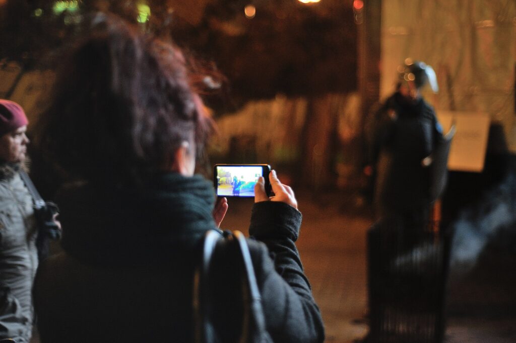 Female using a smartphone to take photographs